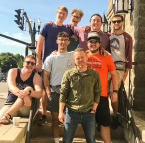 Group of guys posing on steps outside