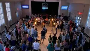 College students gather in circle for worship