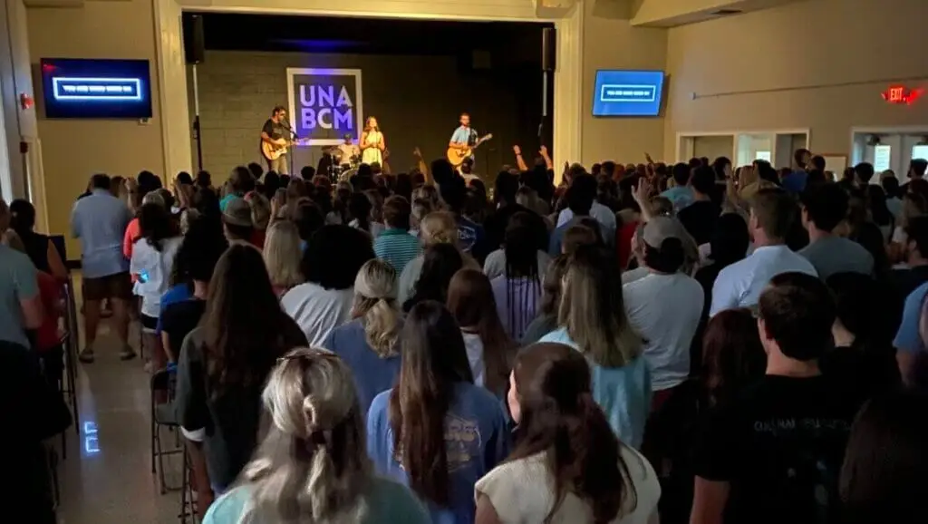 Large group of UNA students gathered for worship at the BCM