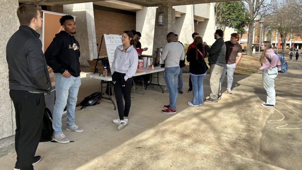 Students from Maryland/Delaware BCMs give away hot chocolate and popcorn on the campus of Auburn University at Montgomery