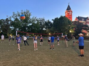 College students play volleyball on the front lawn of Samford Hall at Auburn University